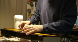 Man working on guitar